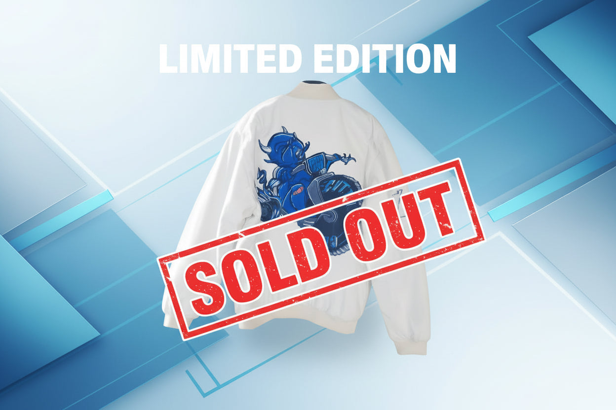 White jacket with blue and black graphic design on a wool surface